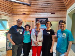 A photo of a group at an event, 3 women and 2 men. Both of the men and one of the women are wearing Voters Not Politicians t-shirts. 
In the group are Jamie Lyons-Eddy, Deputy Director of Voters Not Politicians, and Jim Dowd.